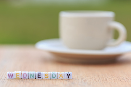Photo of coffee cup and the word Wednesday spelt out in letter cubes