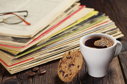 Photo of old magazines and mug of coffee