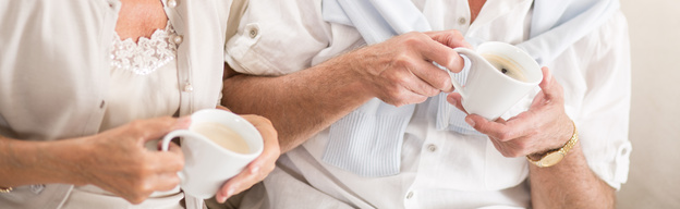 Photo of two people drinking coffee together